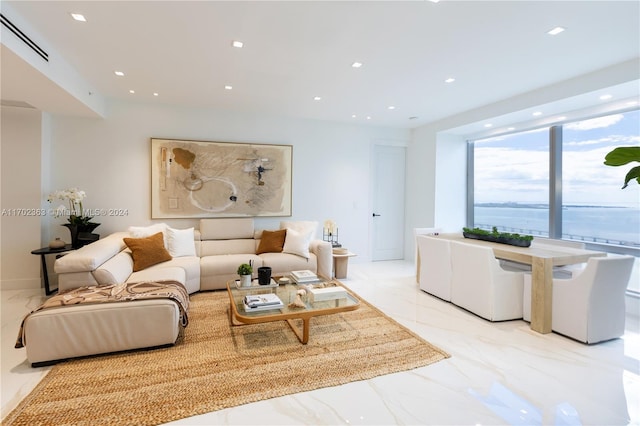 living room featuring a water view