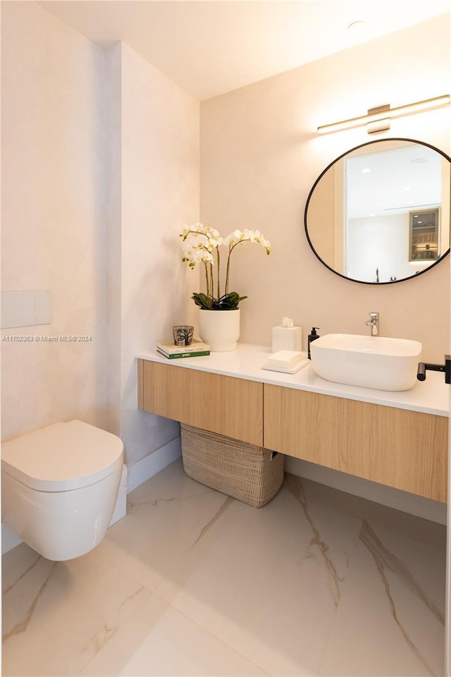 bathroom with vanity and toilet