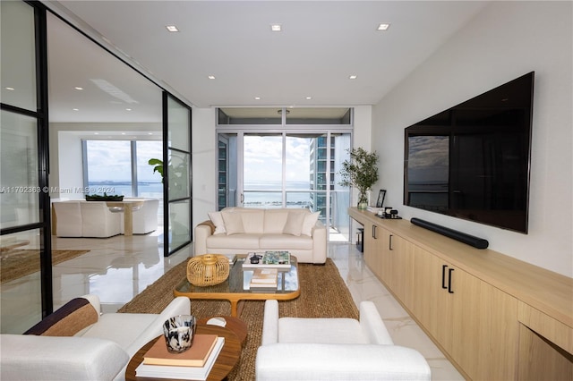 living room with light tile patterned floors and a healthy amount of sunlight