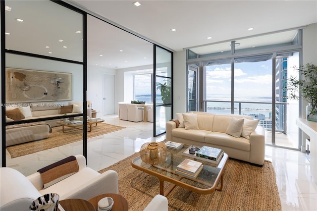 living room featuring floor to ceiling windows