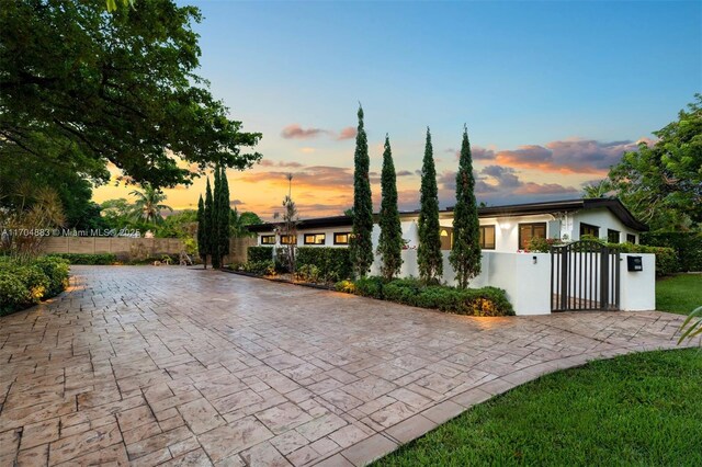 view of patio terrace at dusk