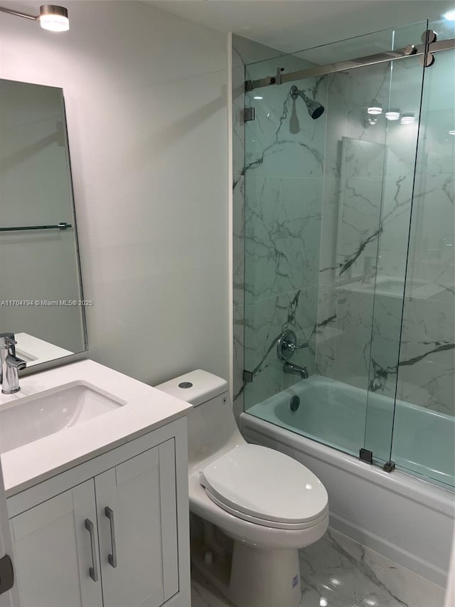 full bathroom with vanity, toilet, and bath / shower combo with glass door