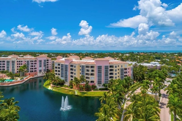 birds eye view of property with a water view