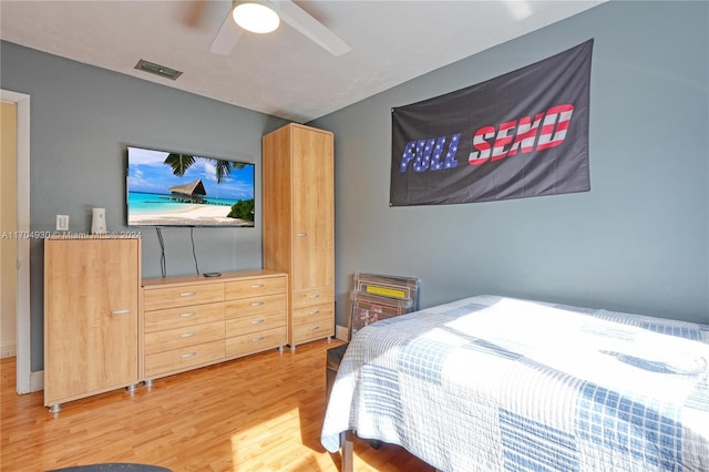 bedroom with ceiling fan and wood-type flooring