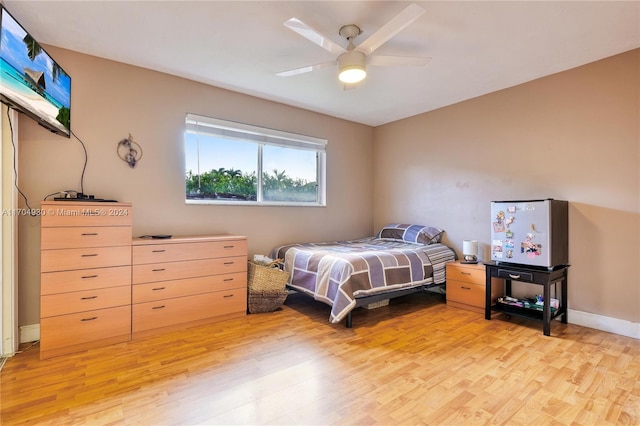 bedroom featuring ceiling fan and light hardwood / wood-style flooring