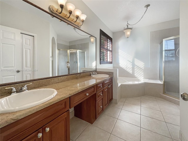 bathroom featuring a wealth of natural light, vanity, and independent shower and bath