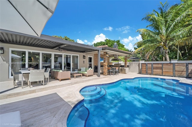 view of pool featuring ceiling fan, area for grilling, and a patio