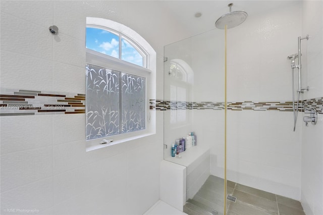 bathroom with tiled shower