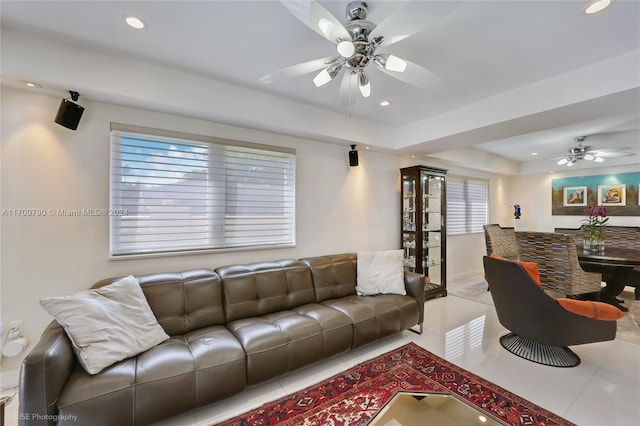 tiled living room featuring ceiling fan