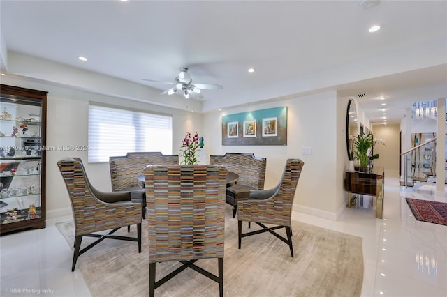 dining room with ceiling fan and light tile patterned flooring