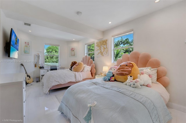 bedroom with light tile patterned flooring