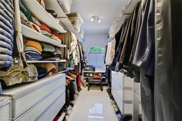 spacious closet with light tile patterned flooring