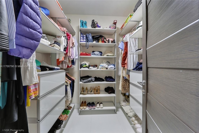 walk in closet featuring light tile patterned floors