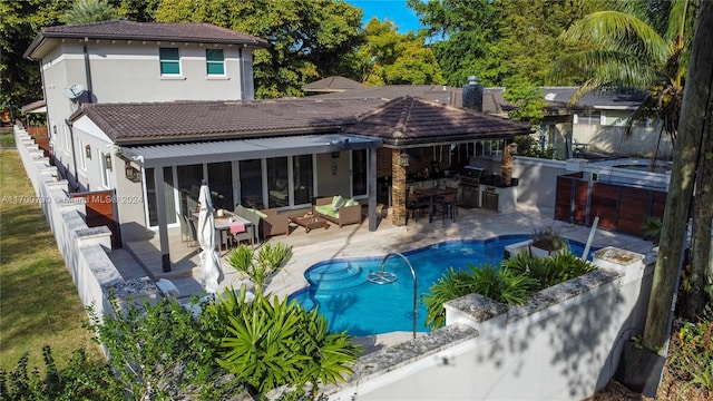 back of property with outdoor lounge area, area for grilling, a fenced in pool, and a patio