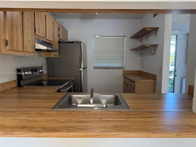 137 NW 93rd Ave Unit 103, Pembroke Pines, FL 33024 - kitchen featuring under cabinet range hood, stainless steel appliances, a sink, and open shelves