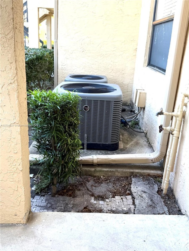 137 NW 93rd Ave Unit 103, Pembroke Pines, FL 33024 - exterior view of cooling unit and stucco siding