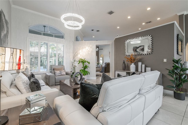 living room with ceiling fan with notable chandelier, ornamental molding, and light tile patterned floors