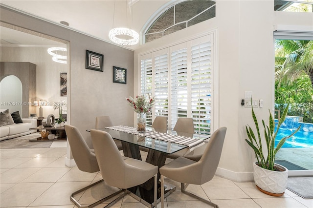 tiled dining space featuring ornamental molding