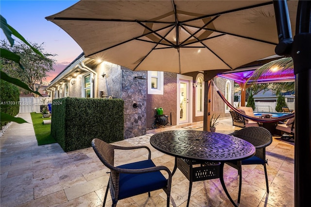 view of patio terrace at dusk