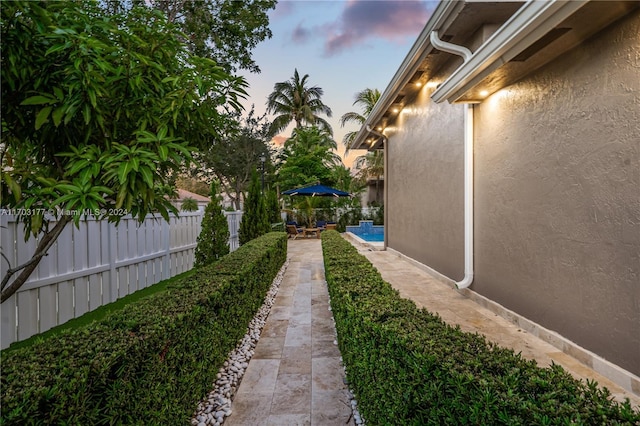 yard at dusk with a patio