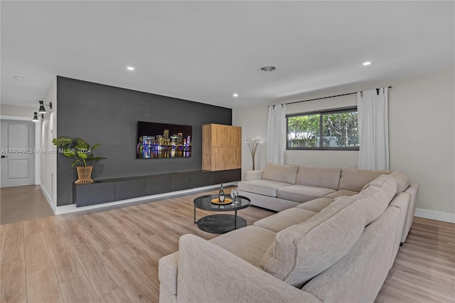 living room with light hardwood / wood-style flooring