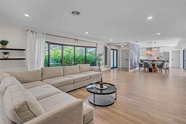 living room with light hardwood / wood-style flooring