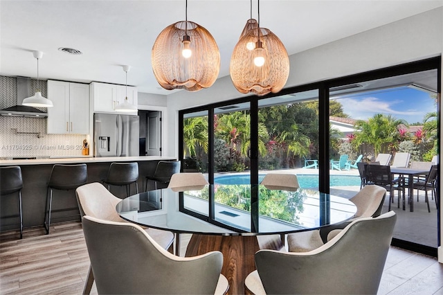 dining room with light hardwood / wood-style floors