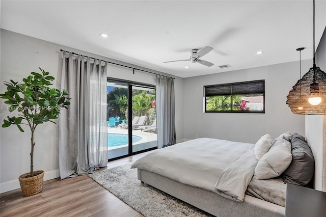 bedroom featuring access to exterior, light hardwood / wood-style flooring, and ceiling fan