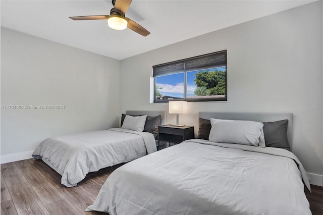 bedroom featuring ceiling fan and hardwood / wood-style flooring