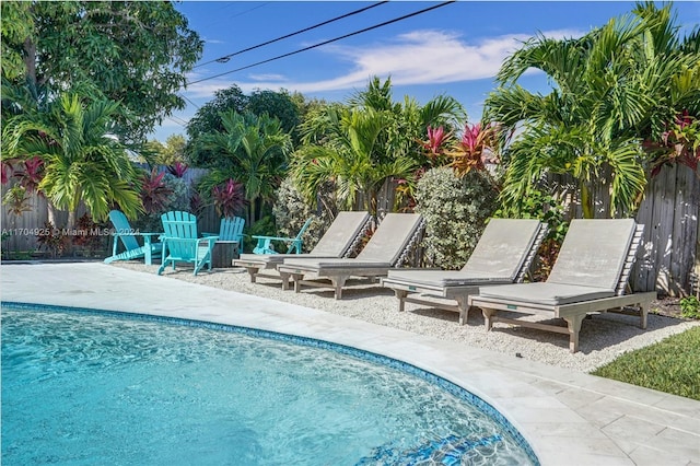 view of swimming pool with a patio