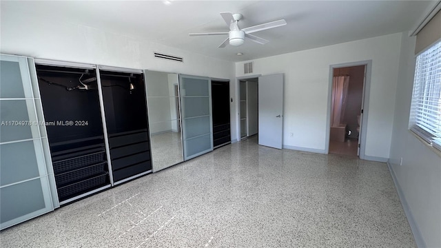 unfurnished bedroom featuring connected bathroom and ceiling fan