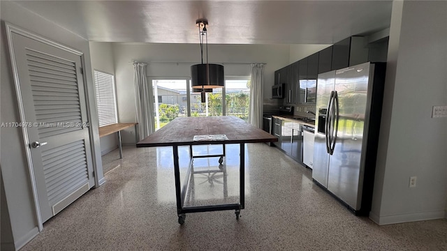 kitchen featuring decorative light fixtures and stainless steel appliances