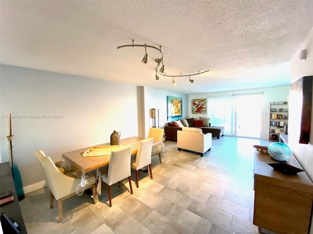 dining room with a textured ceiling