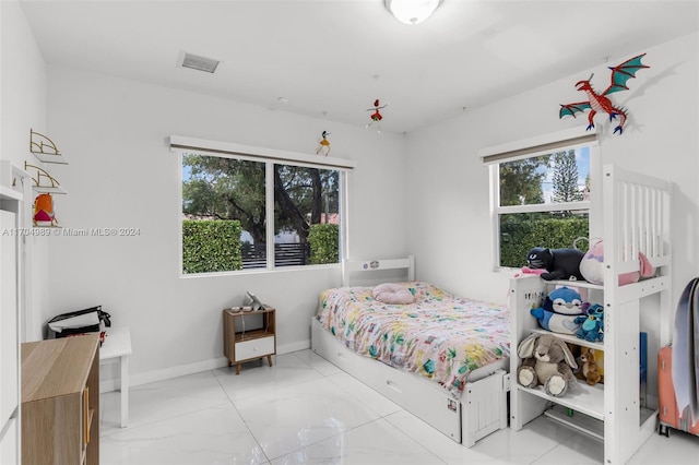 bedroom featuring multiple windows