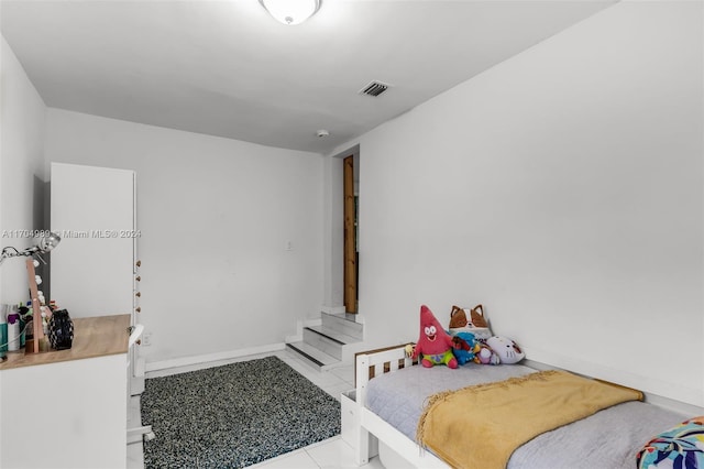 bedroom with light tile patterned flooring