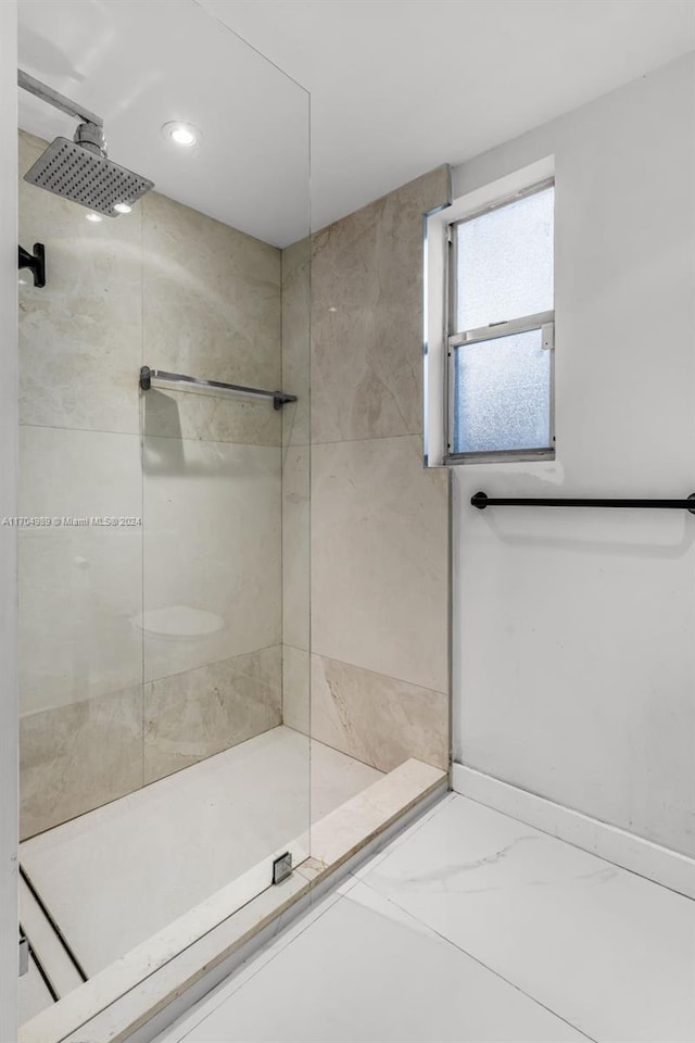 bathroom with tiled shower