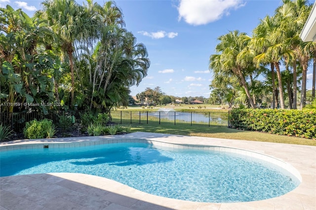 view of pool with a water view