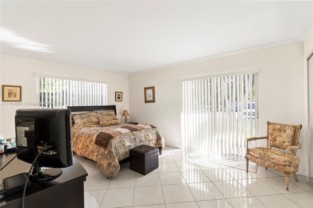 tiled bedroom featuring ornamental molding