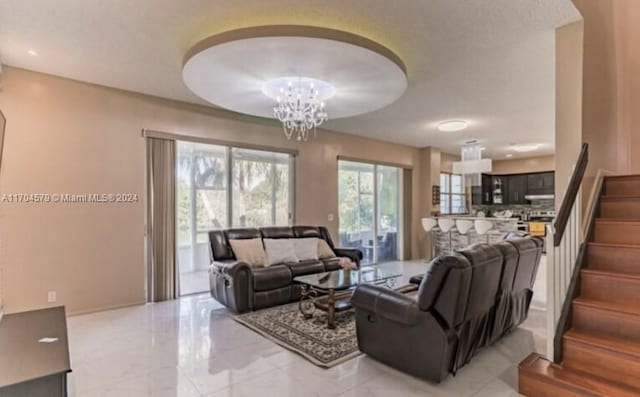 living room featuring an inviting chandelier