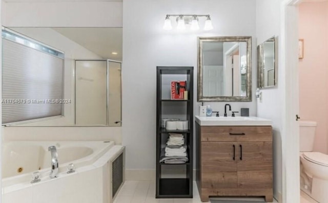 full bathroom featuring tile patterned floors, vanity, toilet, and shower with separate bathtub