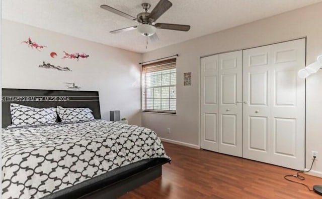 bedroom featuring wood-type flooring, a closet, and ceiling fan