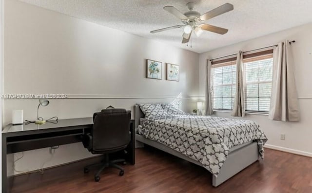 bedroom with a textured ceiling, dark hardwood / wood-style flooring, and ceiling fan