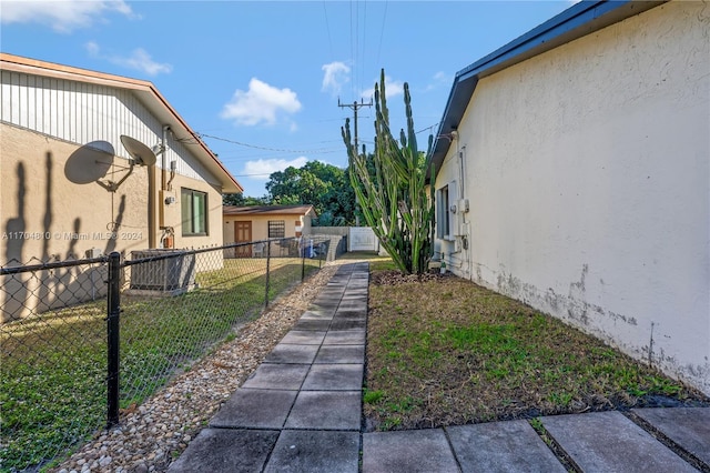 view of yard with central AC unit