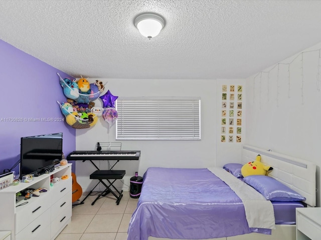 tiled bedroom with a textured ceiling