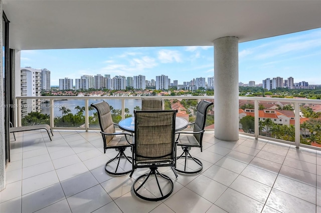 view of patio / terrace featuring a balcony and a water view