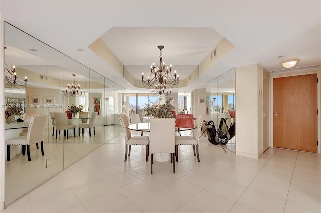 dining space with light tile patterned floors and an inviting chandelier