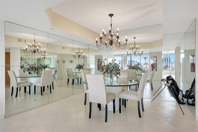 tiled dining area with a textured ceiling