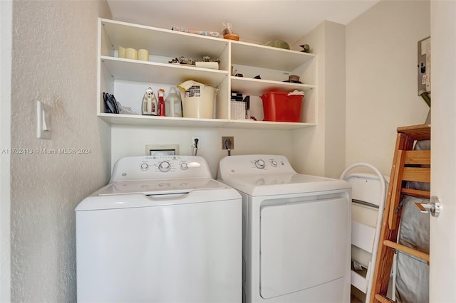 clothes washing area with washing machine and clothes dryer