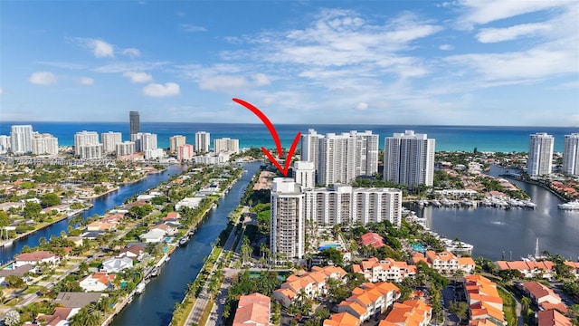 birds eye view of property featuring a water view