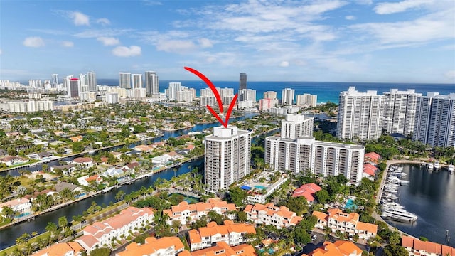 birds eye view of property with a water view